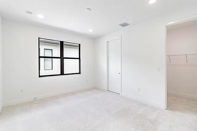 an aerial view of multiple houses with yard