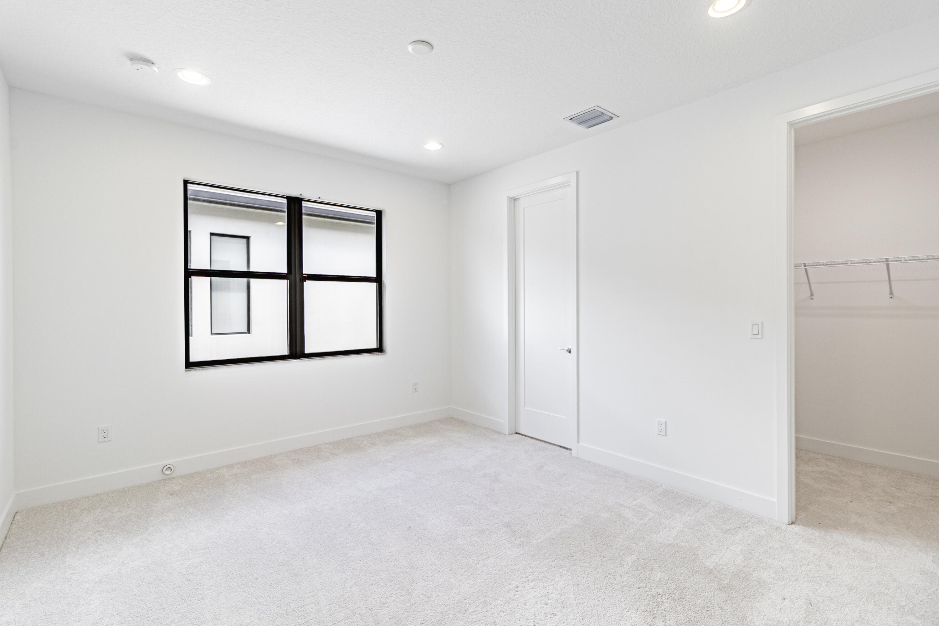 20302 Somerset Hls Drive Boca Raton, FL 33434 - Photo 40 of 111 an empty room with windows and cabinet
