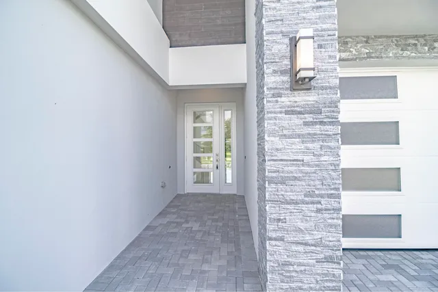 a view of a hallway with brick walls