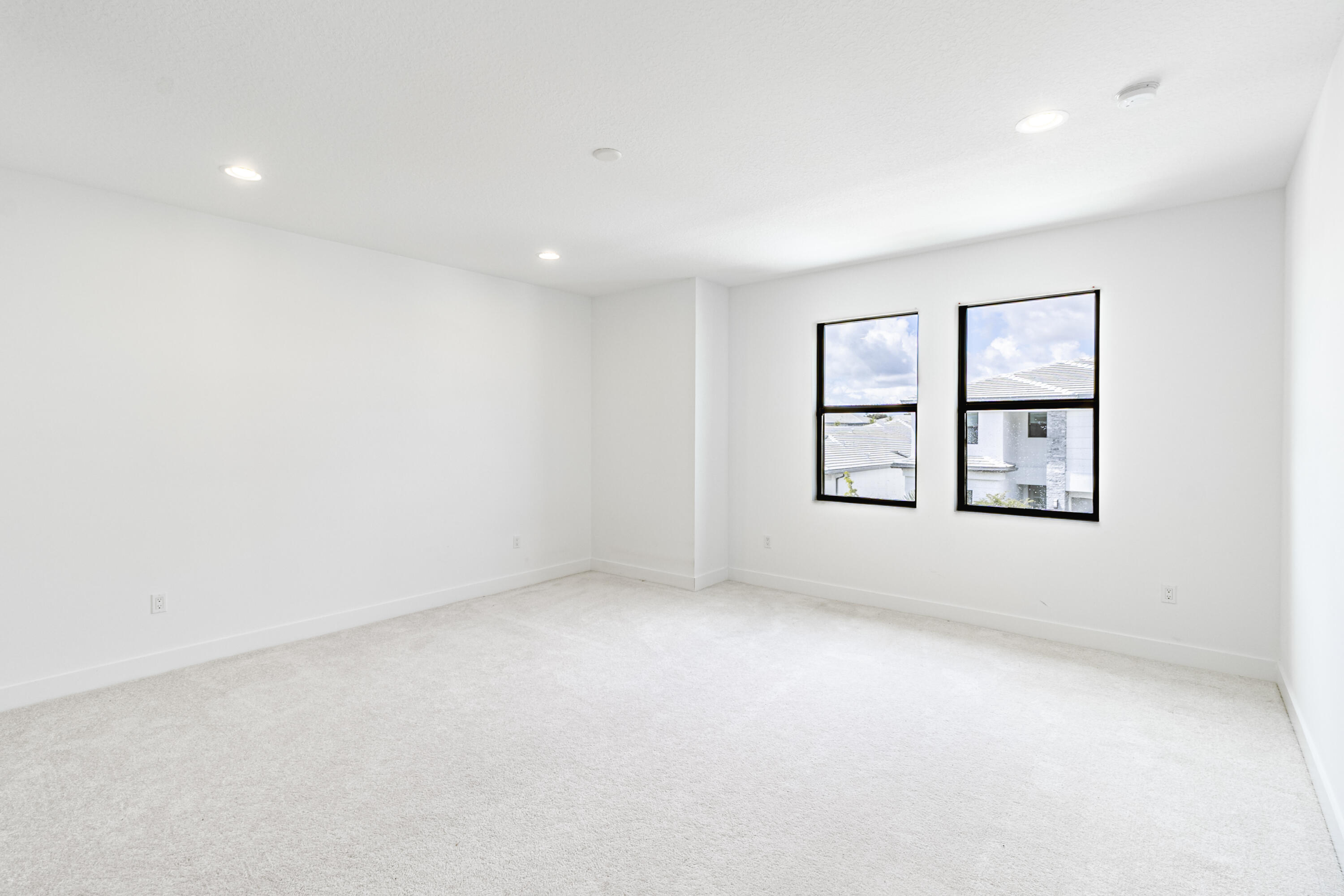 20302 Somerset Hls Drive Boca Raton, FL 33434 - Photo 44 of 111 an empty room with windows and cabinet