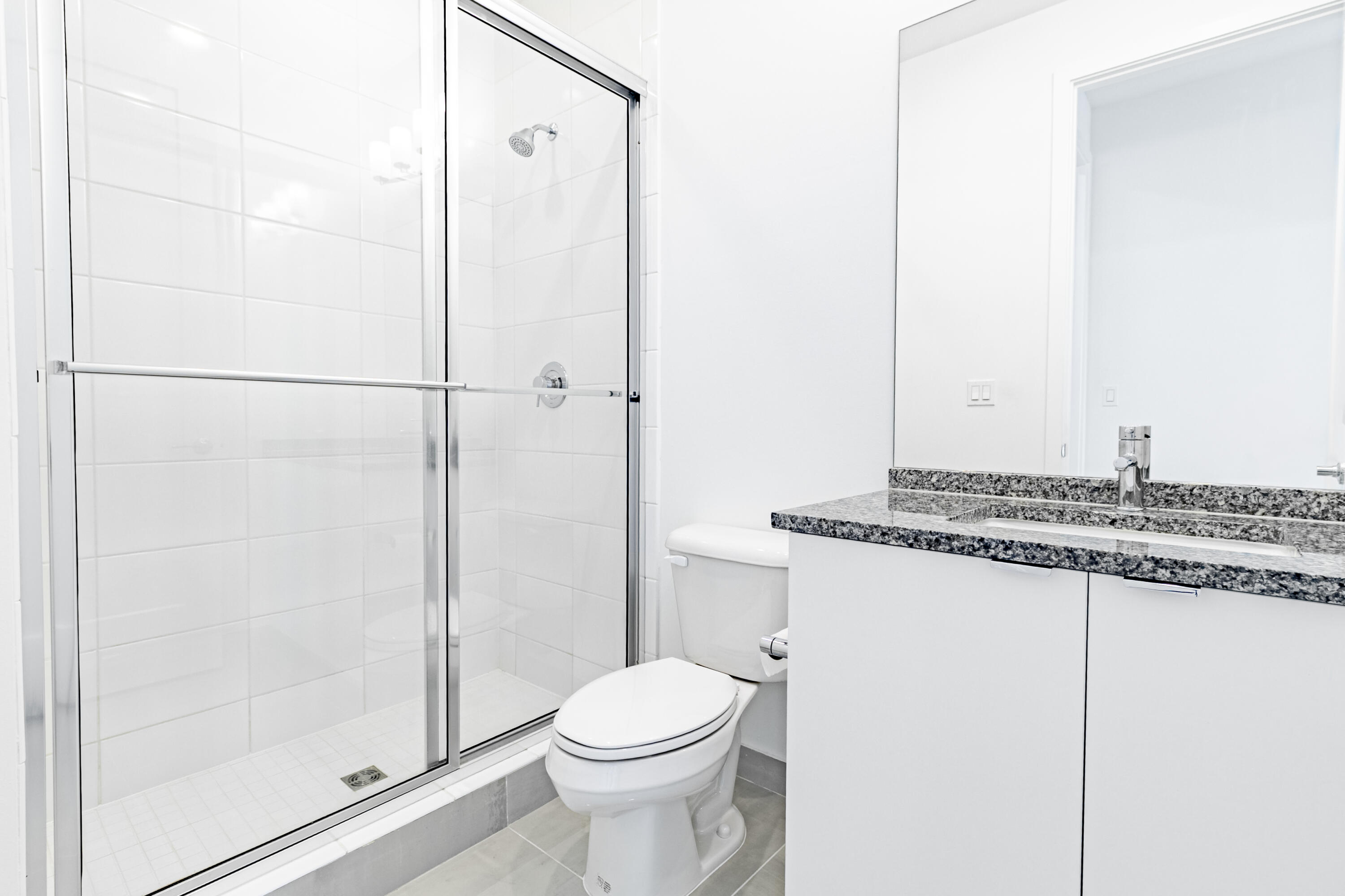 20302 Somerset Hls Drive Boca Raton, FL 33434 - Photo 47 of 111 a bathroom with a granite countertop sink toilet and shower