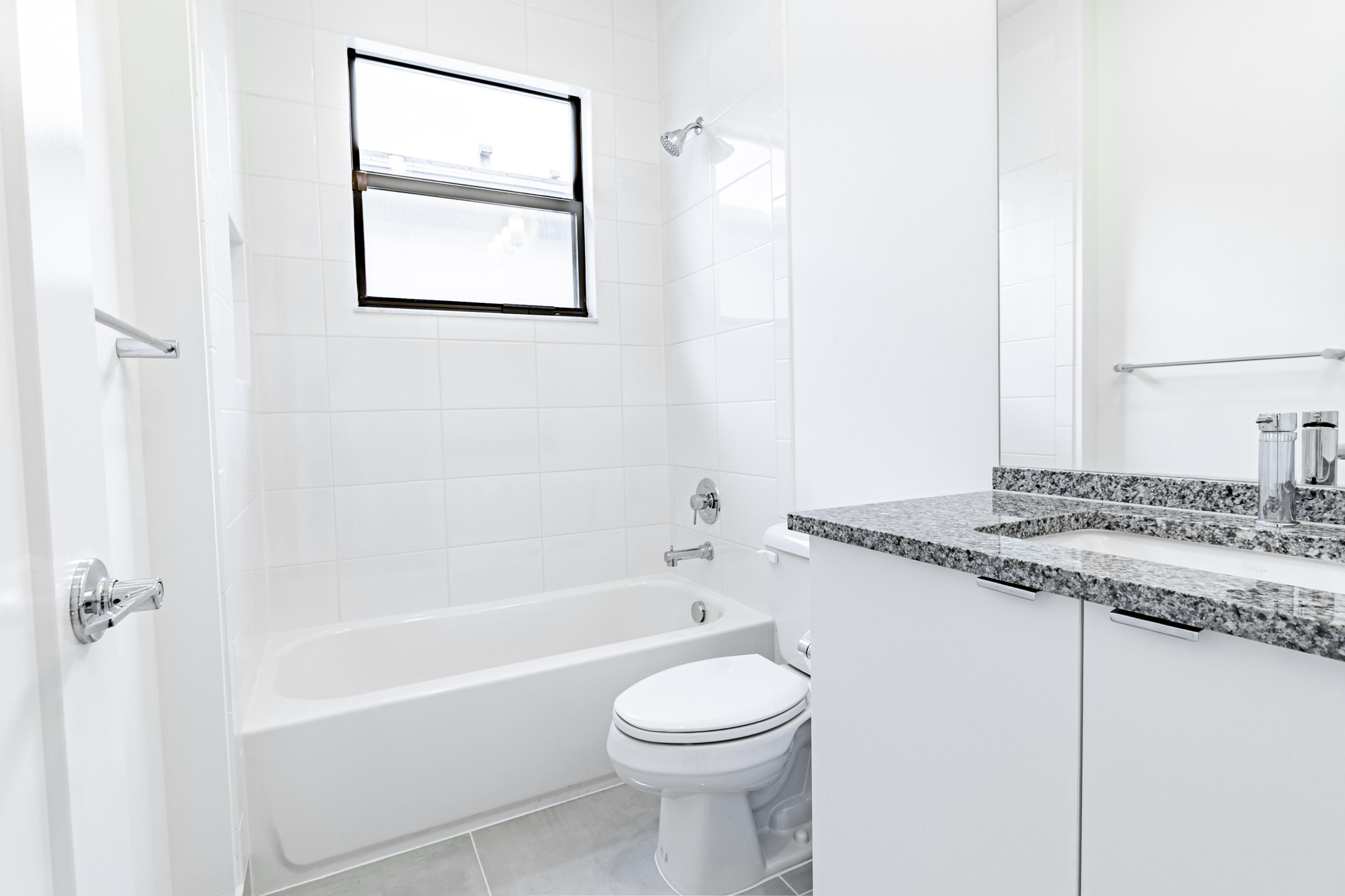 20302 Somerset Hls Drive Boca Raton, FL 33434 - Photo 48 of 111 a bathroom with a granite countertop sink toilet and bathtub