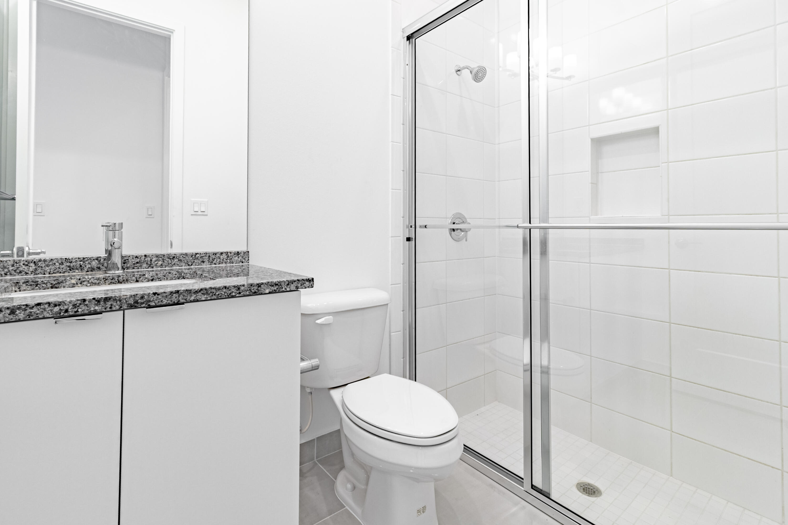 20302 Somerset Hls Drive Boca Raton, FL 33434 - Photo 8 of 111 a bathroom with a granite countertop sink toilet and shower