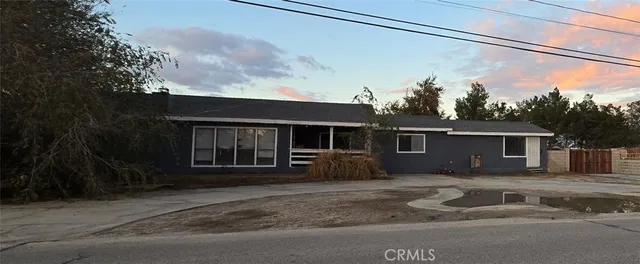 a house view with a backyard space