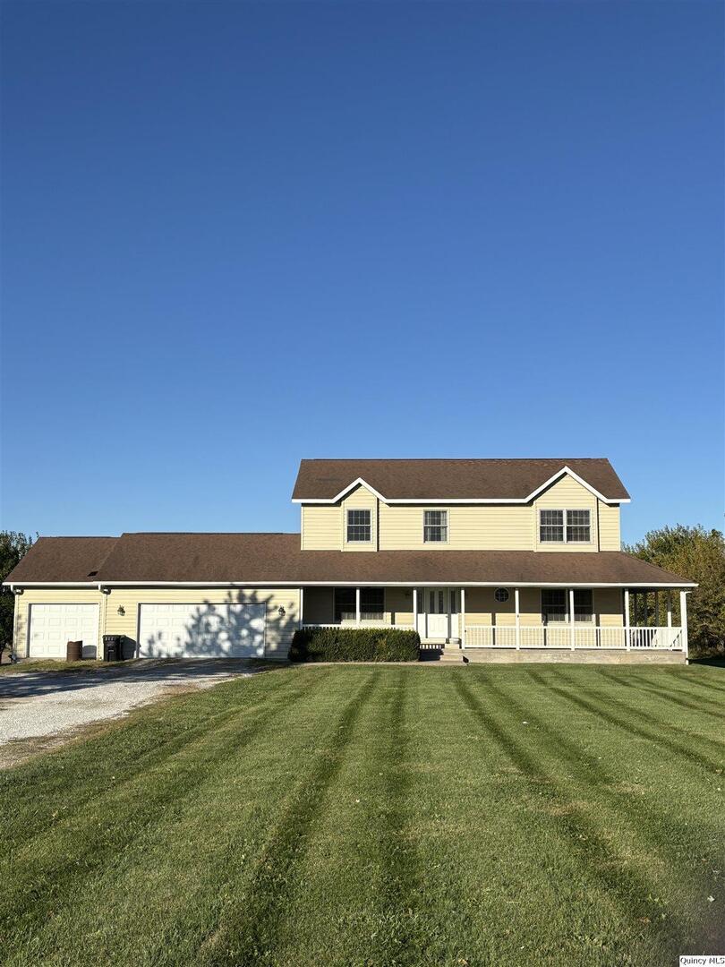 1848 North Co Road 1700 Carthage, IL 62321 - Photo 1 of 33 a front view of a house with a big yard