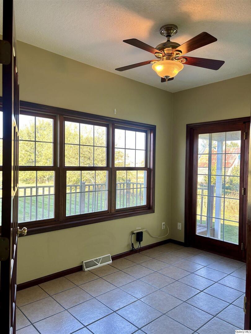 1848 North Co Road 1700 Carthage, IL 62321 - Photo 12 of 33 a view of an empty room with a window