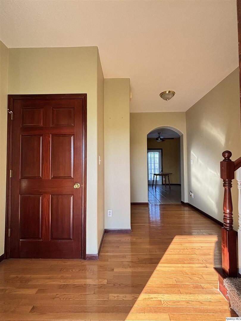 1848 North Co Road 1700 Carthage, IL 62321 - Photo 2 of 33 a view of a hallway with entryway wooden floor and windows