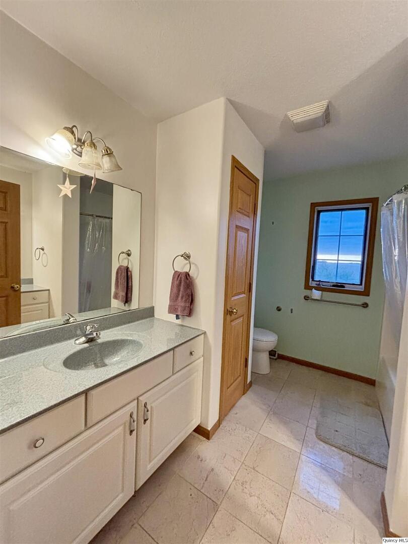 1848 North Co Road 1700 Carthage, IL 62321 - Photo 24 of 33 a spacious bathroom with a sink and a mirror