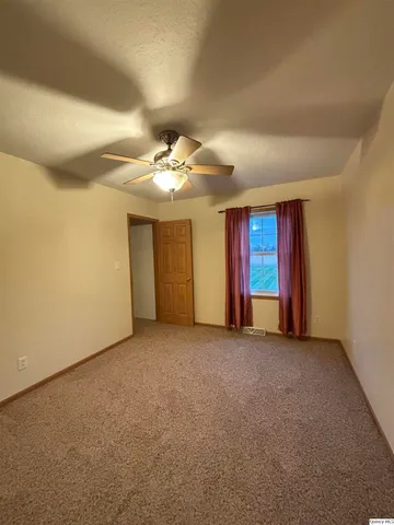 a view of a room with closet and wooden floor