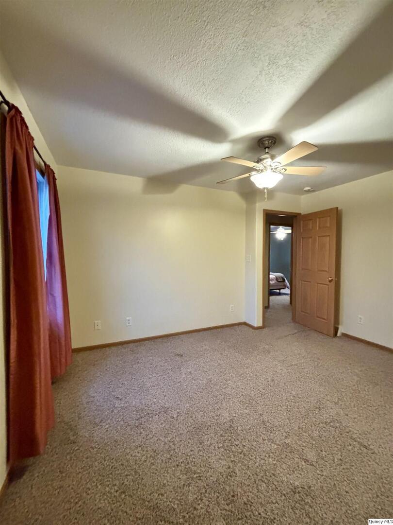 1848 North Co Road 1700 Carthage, IL 62321 - Photo 30 of 33 a view of a room with closet and wooden floor