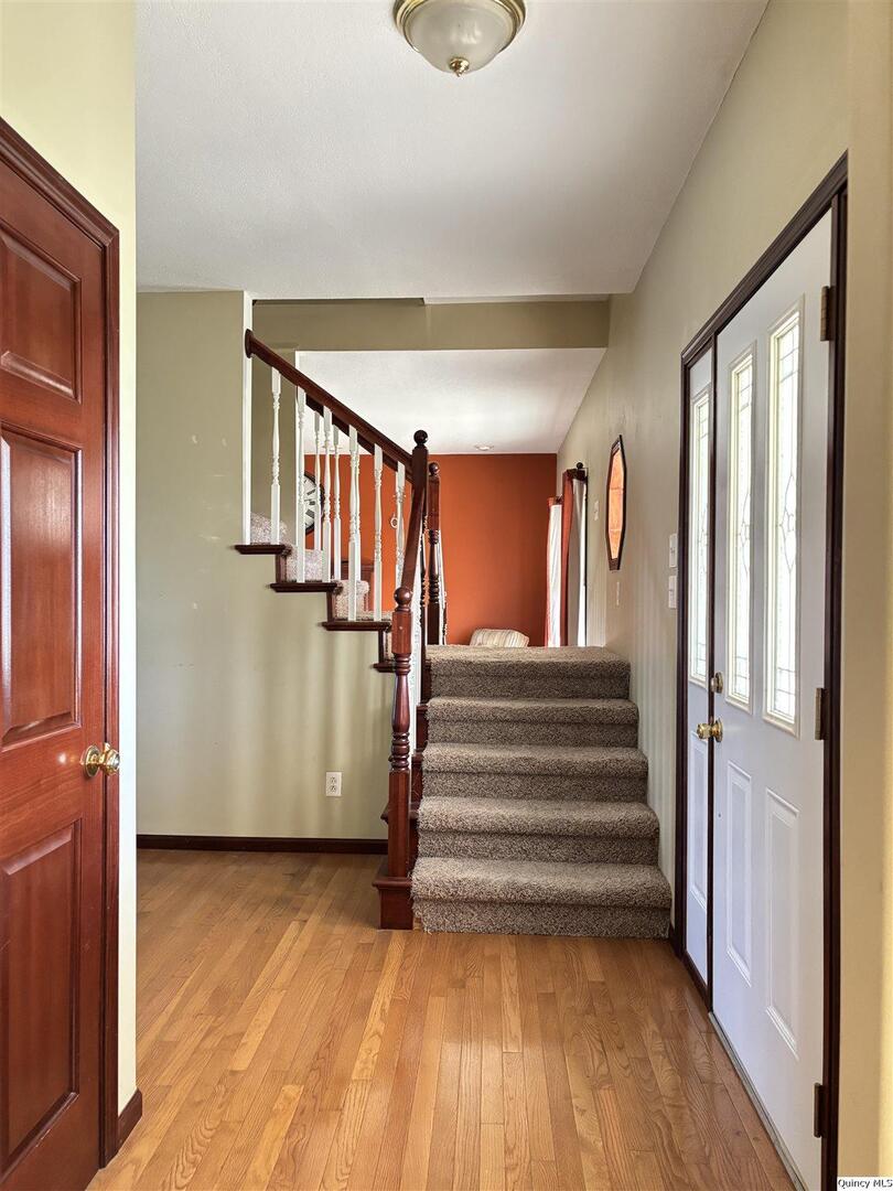 1848 North Co Road 1700 Carthage, IL 62321 - Photo 3 of 33 a view of entryway with wooden floor and stairs