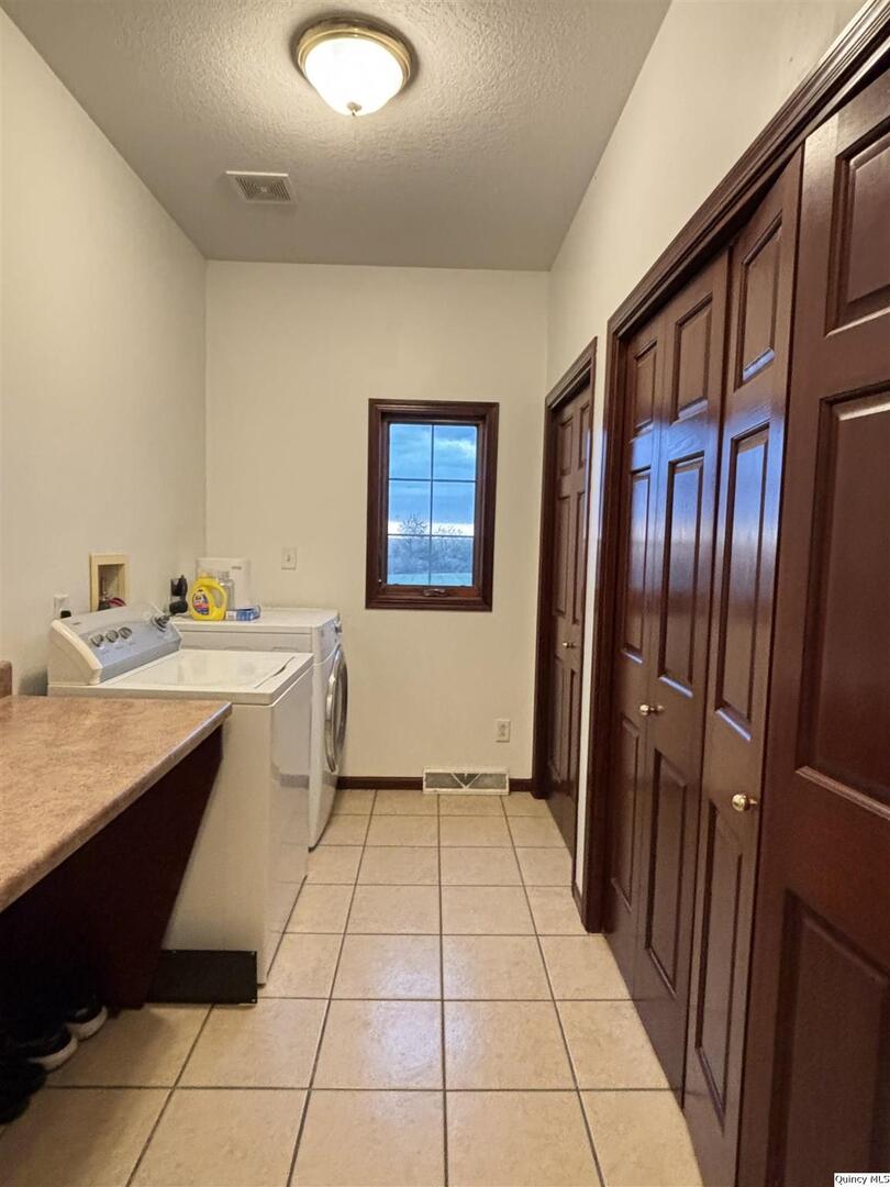1848 North Co Road 1700 Carthage, IL 62321 - Photo 6 of 33 a kitchen with stainless steel appliances granite countertop a refrigerator and a sink