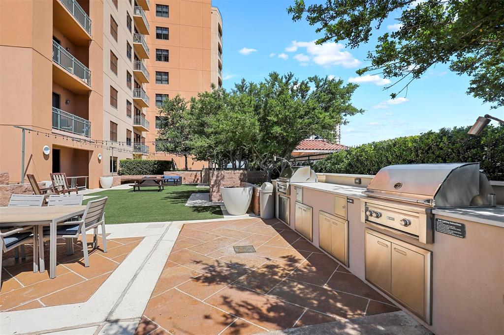 330 Las Colinas Boulevard East, Unit 232 Irving, TX 75039 - Photo 14 of 14 a view of a patio with a table and chairs