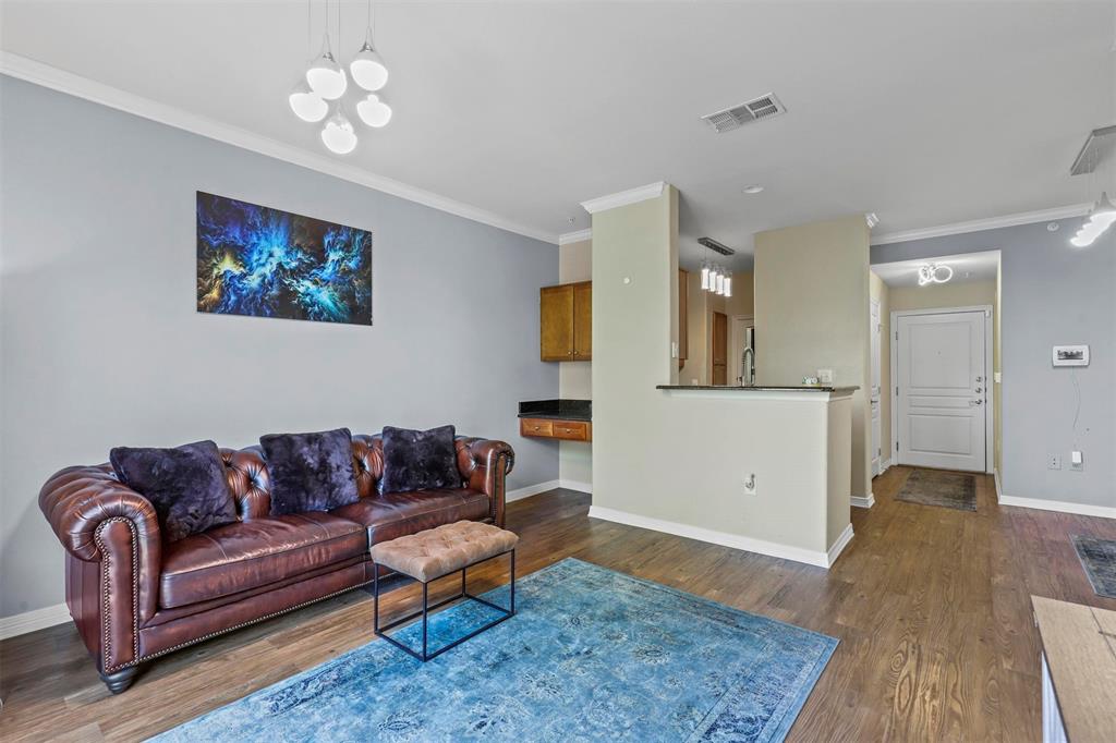 330 Las Colinas Boulevard East, Unit 232 Irving, TX 75039 - Photo 7 of 14 a living room with furniture and a wooden floor
