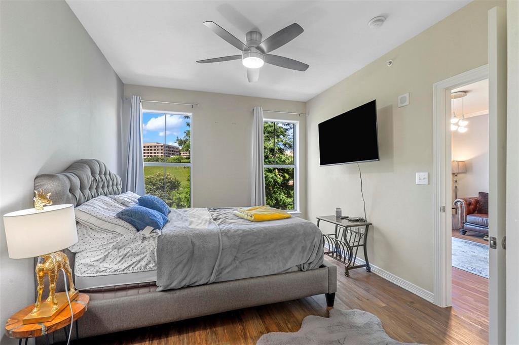 330 Las Colinas Boulevard East, Unit 232 Irving, TX 75039 - Photo 9 of 14 a bedroom with a bed and a flat screen tv