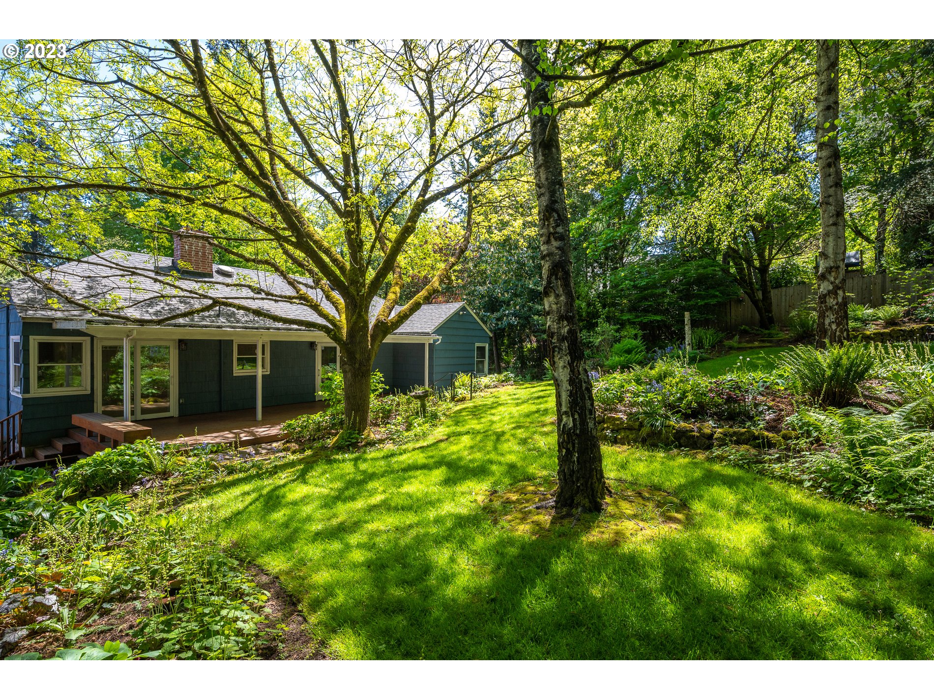 8201 Southwest 41st Avenue Portland, OR 97219 - Photo 17 of 23 a front view of a house with garden