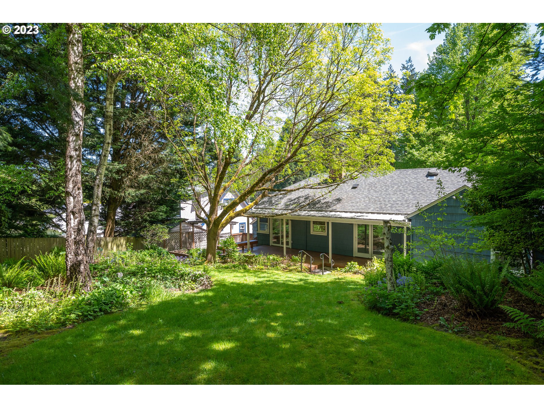 8201 Southwest 41st Avenue Portland, OR 97219 - Photo 19 of 23 a aerial view of a house with a yard table and chairs