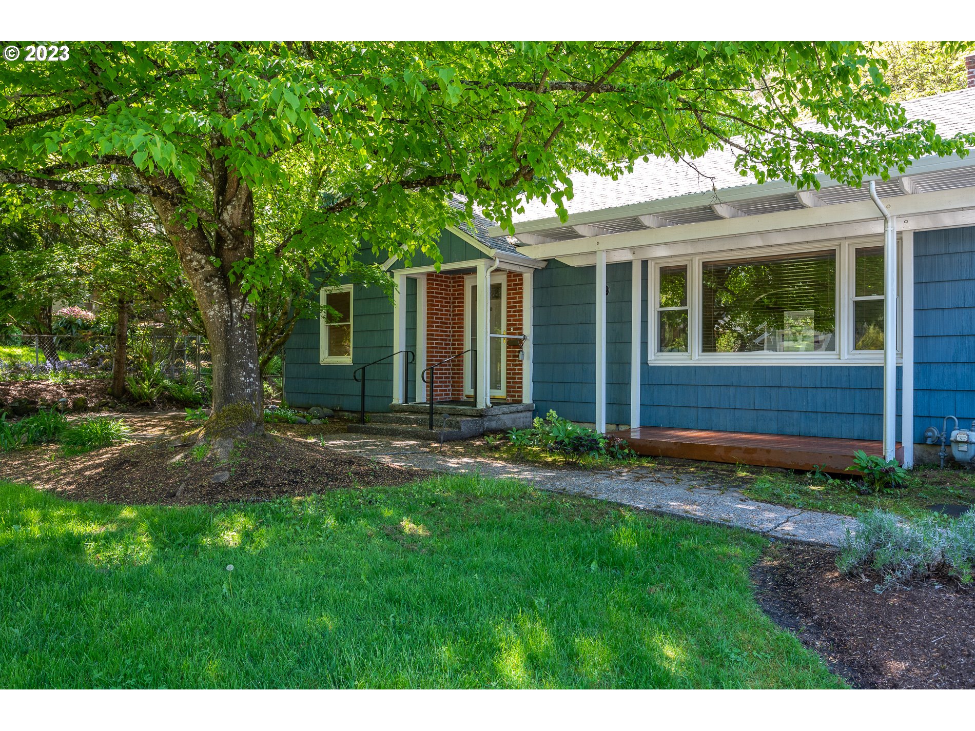 8201 Southwest 41st Avenue Portland, OR 97219 - Photo 2 of 23 a view of a house with a yard and porch