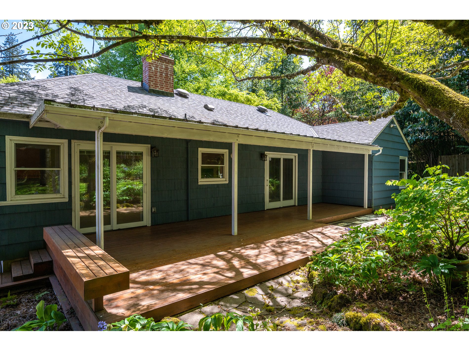 8201 Southwest 41st Avenue Portland, OR 97219 - Photo 21 of 23 a front view of a house with garden
