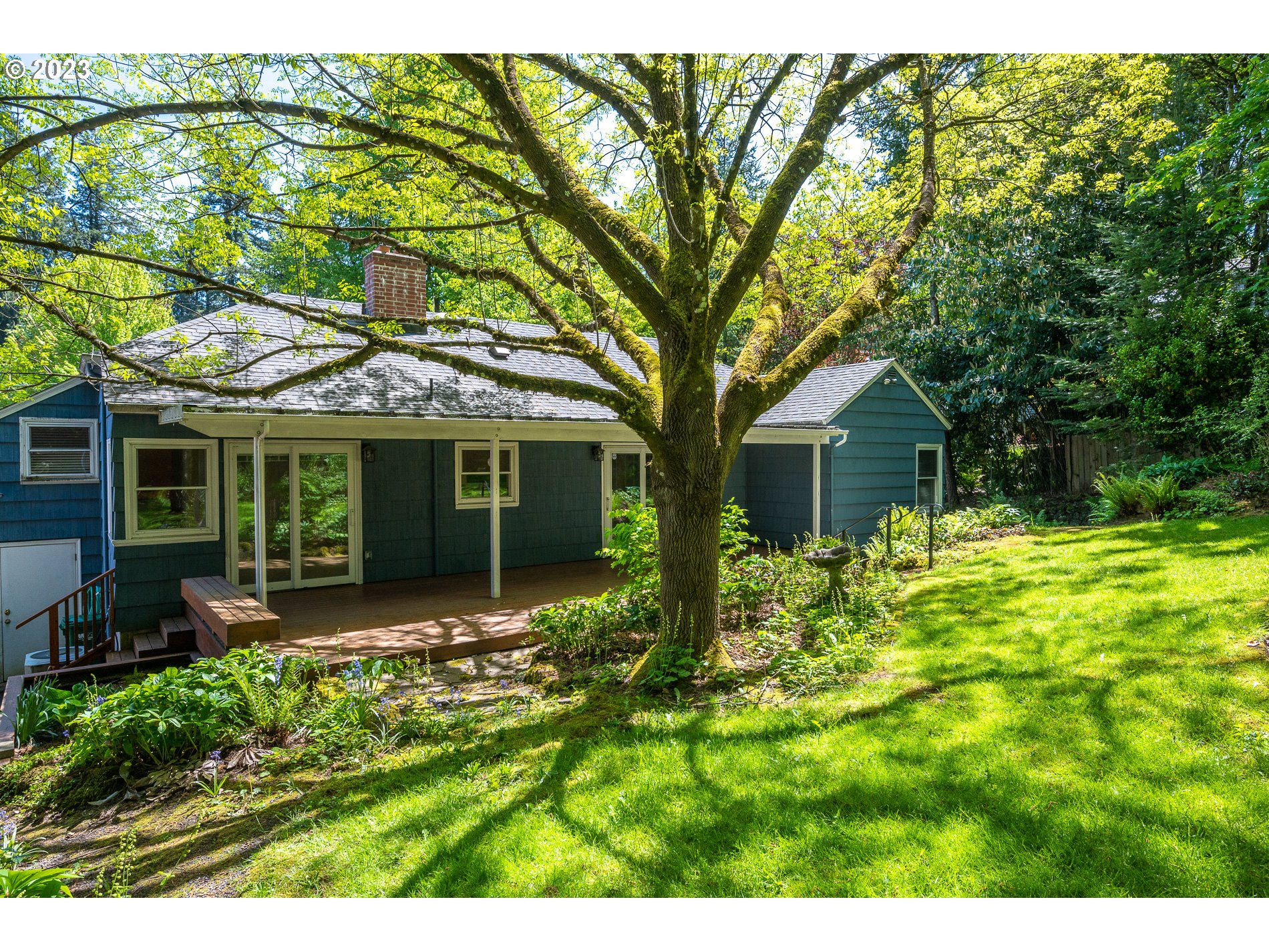 8201 Southwest 41st Avenue Portland, OR 97219 - Photo 22 of 23 a front view of a house with garden