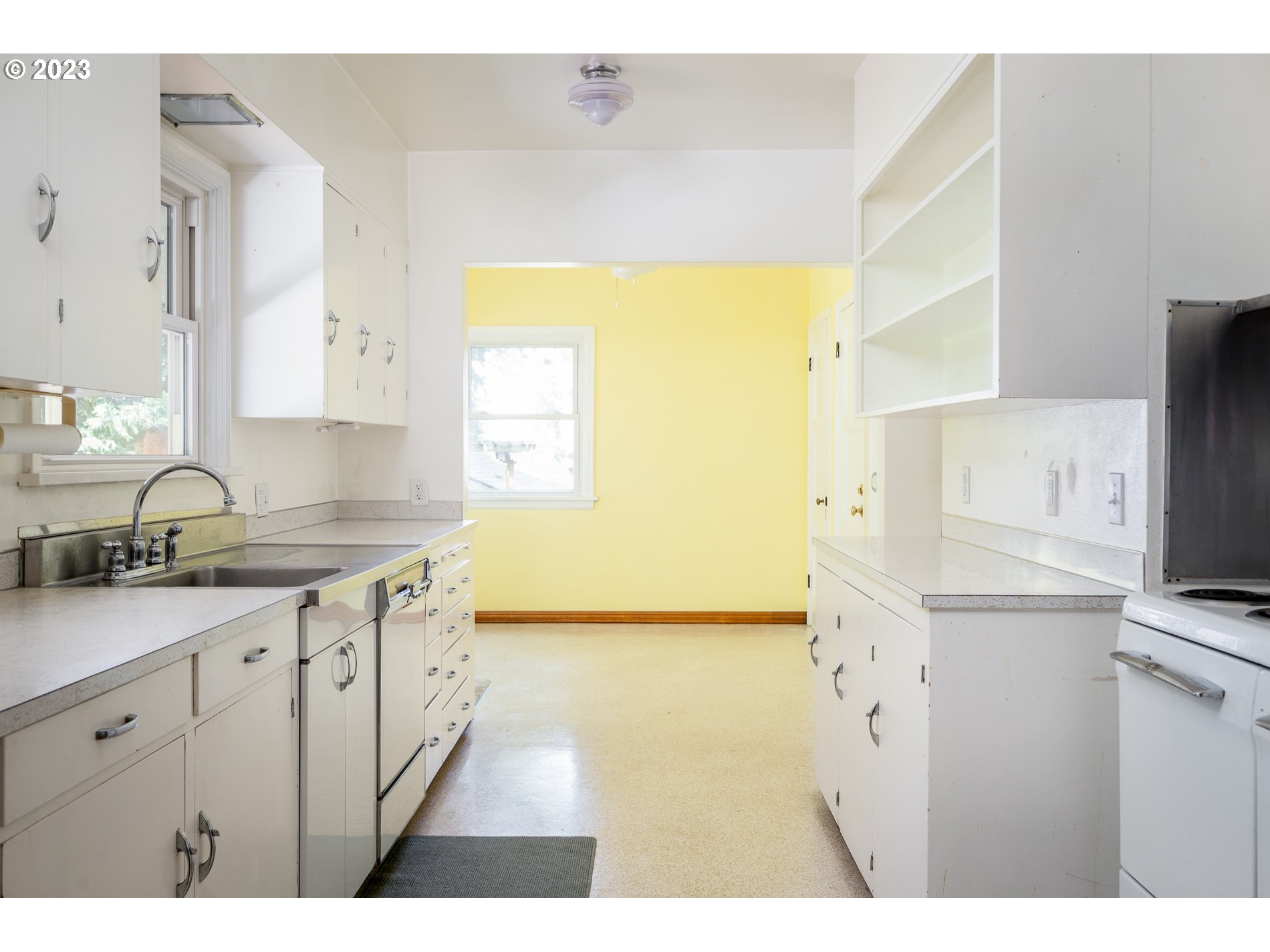 8201 Southwest 41st Avenue Portland, OR 97219 - Photo 8 of 23 a kitchen with granite countertop a sink stainless steel appliances and cabinets