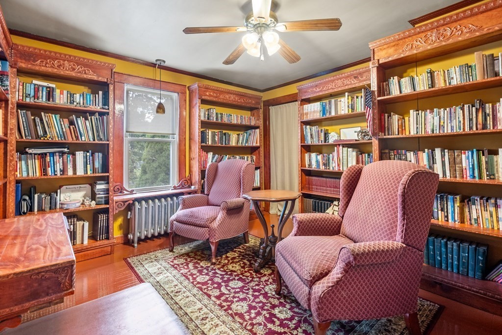65 NW Road Westfield, MA 01085 - Photo 14 of 29 a living room with furniture and a book shelf