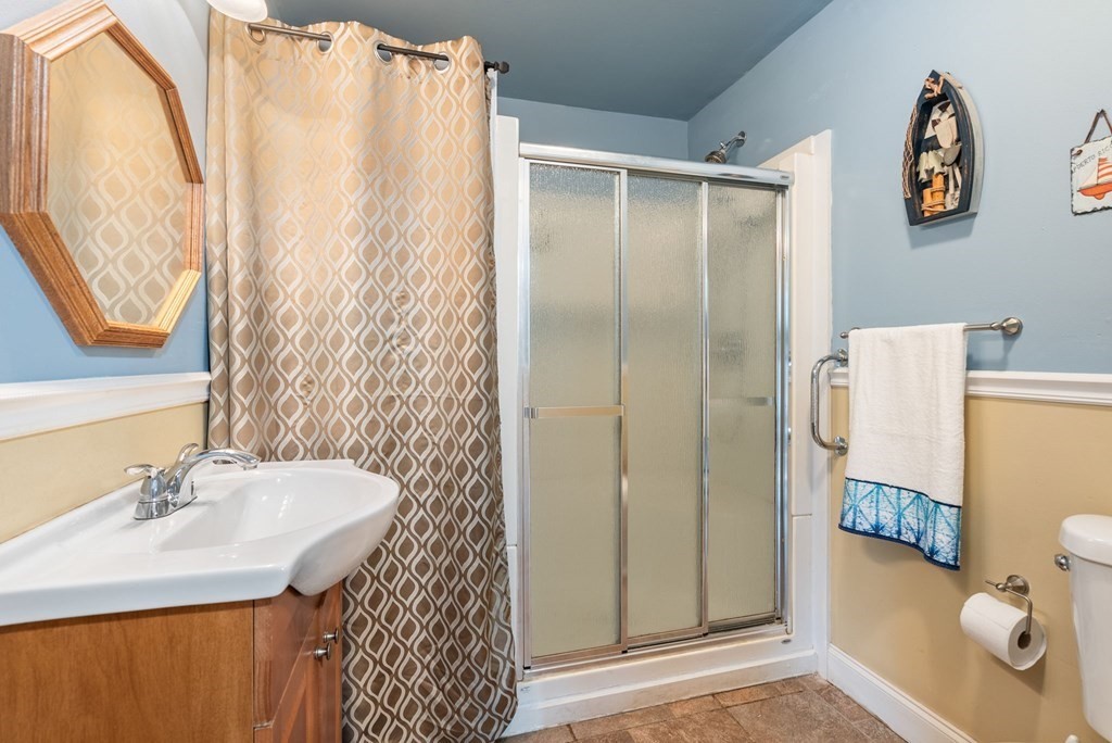 65 NW Road Westfield, MA 01085 - Photo 15 of 29 a bathroom with a sink toilet and shower