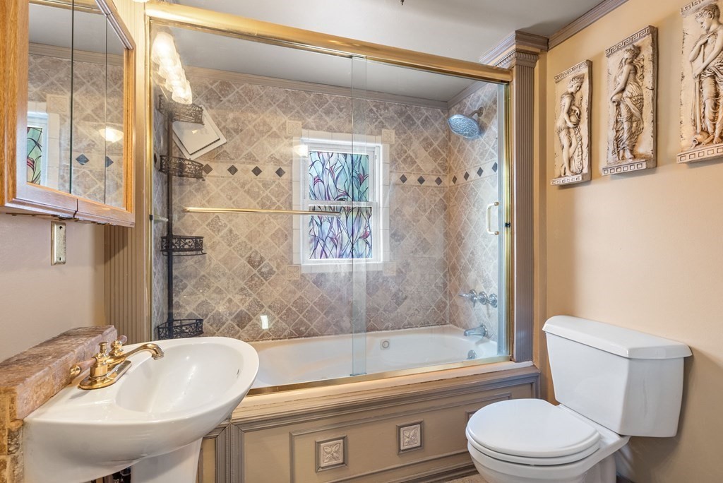 65 NW Road Westfield, MA 01085 - Photo 18 of 29 a bathroom with a sink toilet and shower