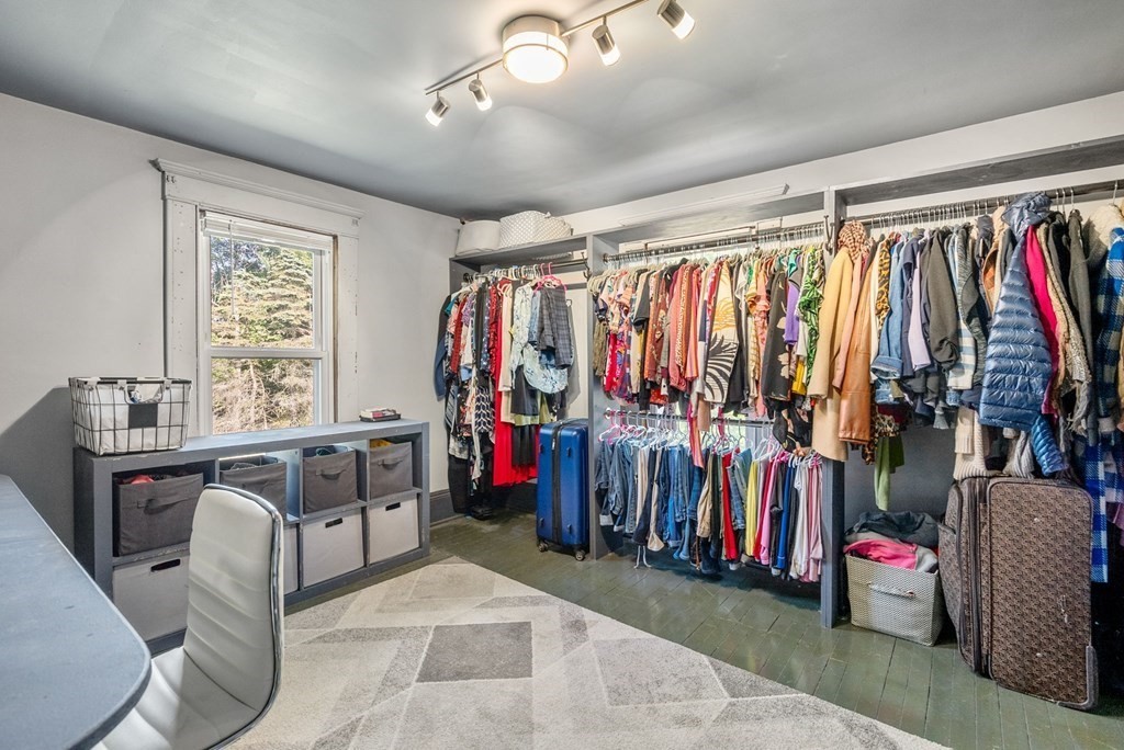 65 NW Road Westfield, MA 01085 - Photo 20 of 29 a view of walk in closet with clothes and shoes