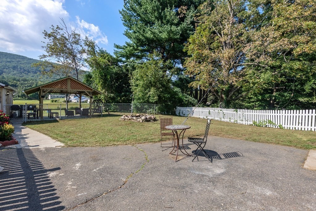 65 NW Road Westfield, MA 01085 - Photo 24 of 29 a view of a house with swimming pool and sitting area