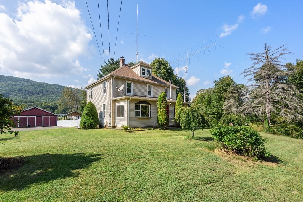 65 NW Road Westfield, MA 01085 - Photo 26 of 29 a front view of a house with a yard