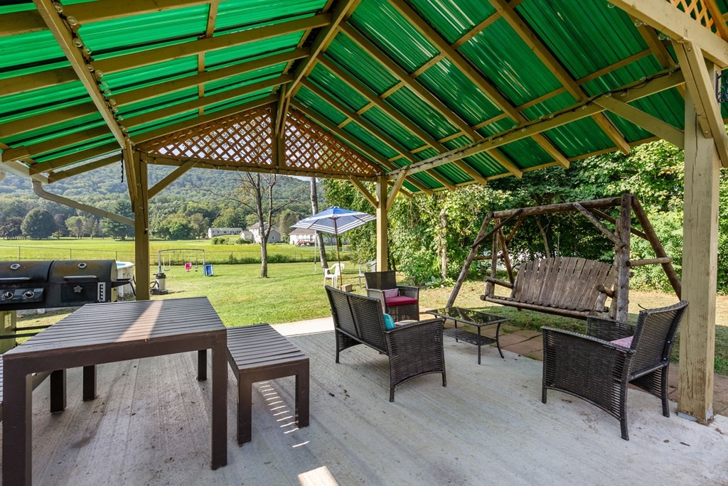 65 NW Road Westfield, MA 01085 - Photo 29 of 29 a patio with yard table and chairs