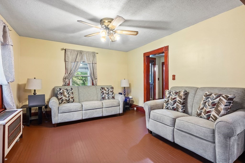 65 NW Road Westfield, MA 01085 - Photo 9 of 29 a living room with furniture and a large window