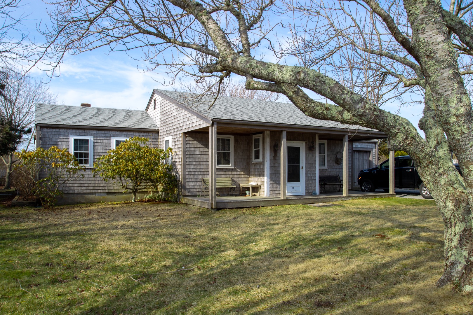 11 Newtown Road Nantucket, MA 02554 - Photo 2 of 20 a view of a house with a large tree and a yard