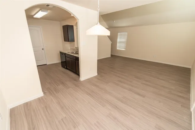 a view of a kitchen cabinets and wooden floor