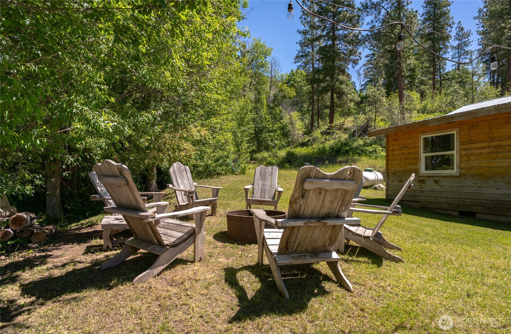 579 Eastside Chewuch Road Winthrop, WA 98862 - Photo 12 of 37 a view of a chairs and table in a backyard