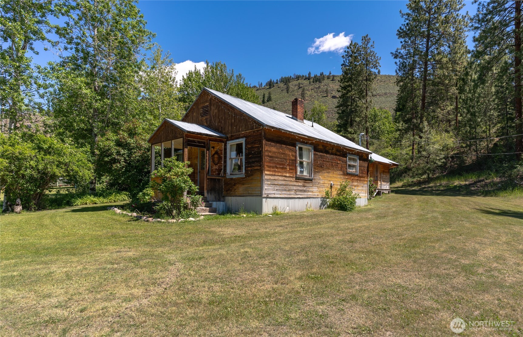 579 Eastside Chewuch Road Winthrop, WA 98862 - Photo 15 of 37 a view of a house with a yard
