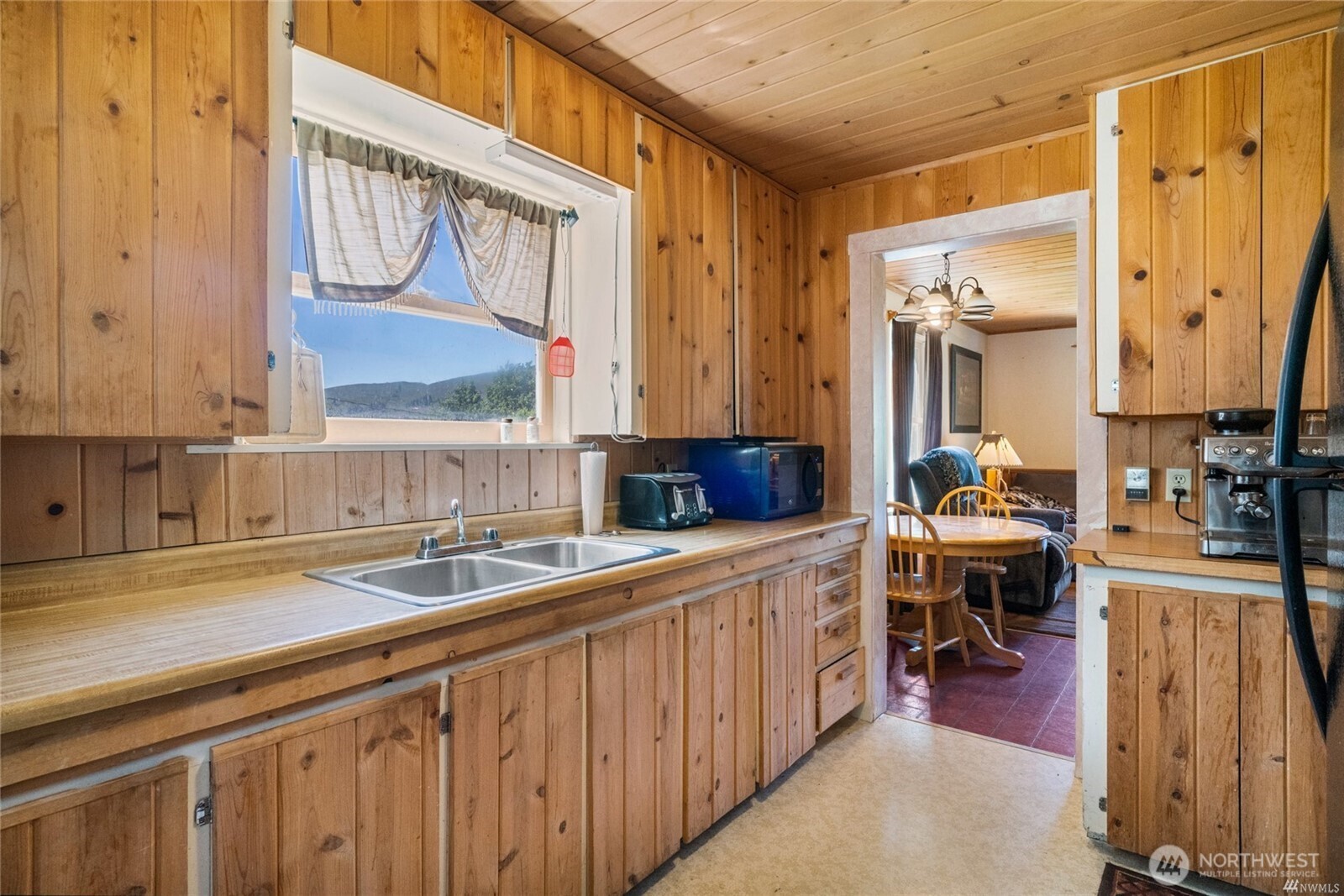 579 Eastside Chewuch Road Winthrop, WA 98862 - Photo 17 of 37 a kitchen with stainless steel appliances a sink and cabinets