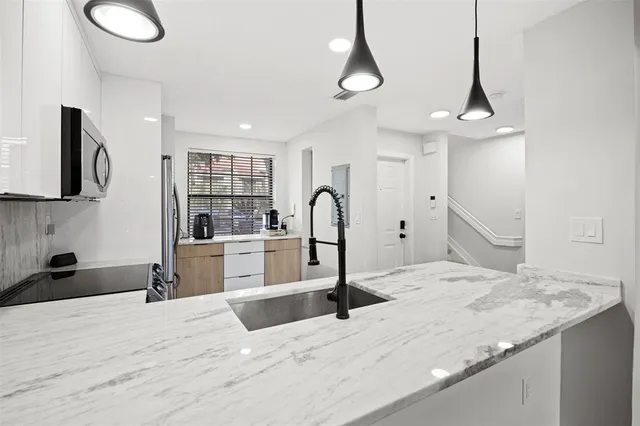 a room with a bed and a flat screen tv