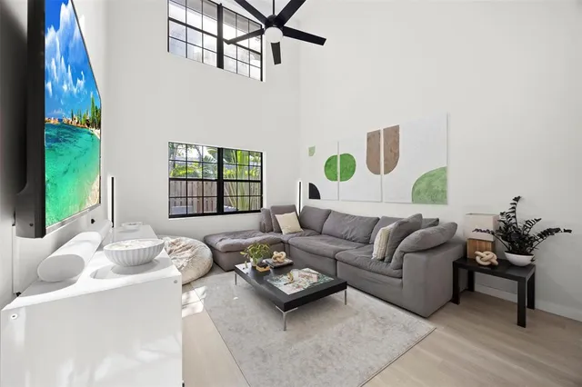 a living room with furniture and a large window