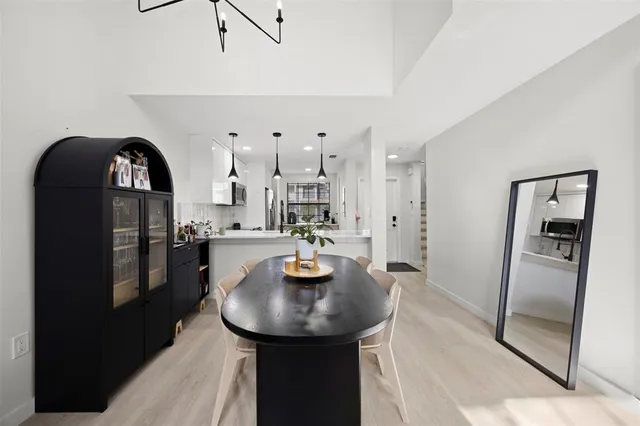 a kitchen with stainless steel appliances granite countertop a sink a refrigerator and a stove