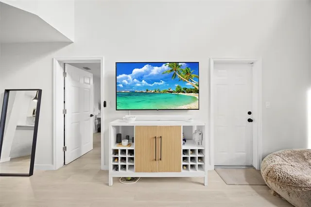 a room with furniture and a flat screen tv