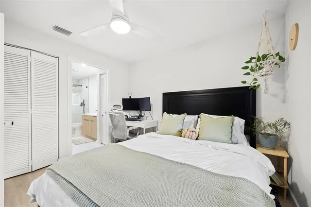 a bedroom with a bed and a television