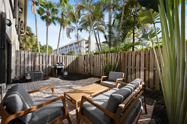 a view of outdoor sitting area with furniture