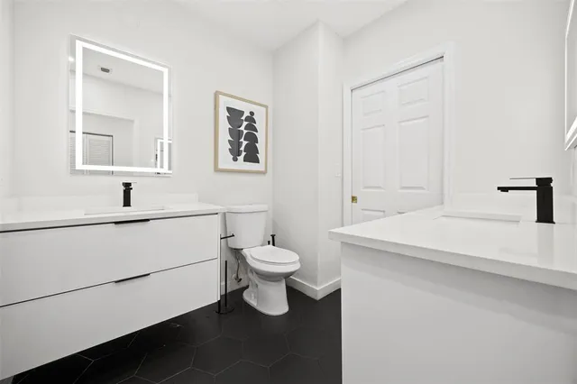 a room with furniture and a flat screen tv