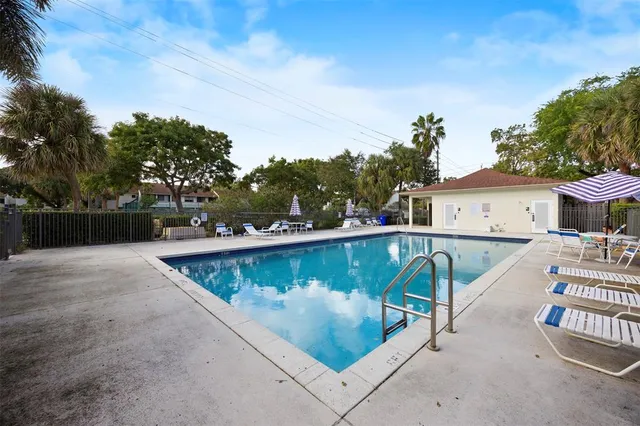 a view of swimming pool with chairs