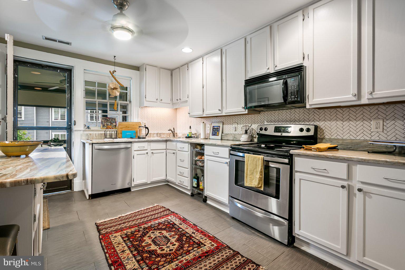610 Somerset Road, Unit 302 Baltimore, MD 21210 - Photo 16 of 35 kitchen with gas stove, dishwasher, microwave