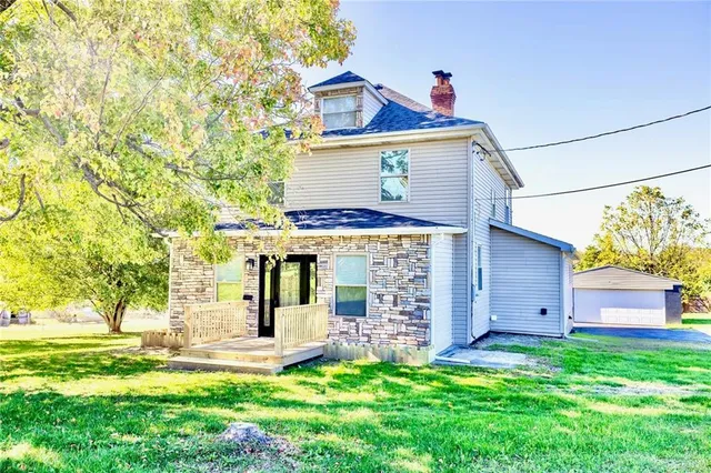 front view of a house with a yard