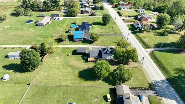 an aerial view of residential houses with outdoor space