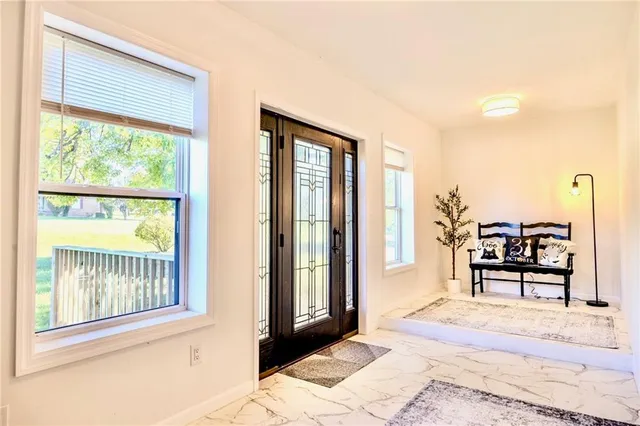 a bedroom with furniture and a window